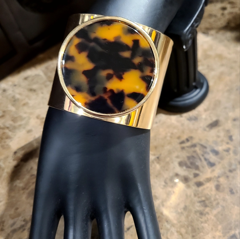 Gold tone tortoise cuff bracelet